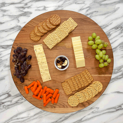 GIF Cherry Lazy Susan spinning with cheese, crackers, and grapes on it. 