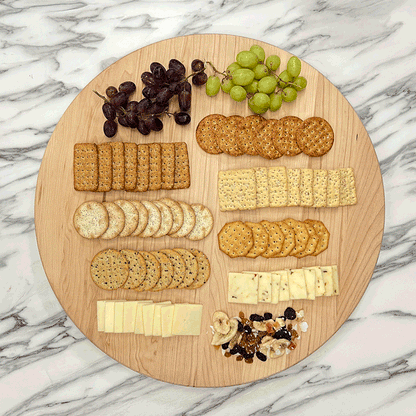 GIF Maple Lazy Susan spinning on a marble countertop with cheese and crackers.
