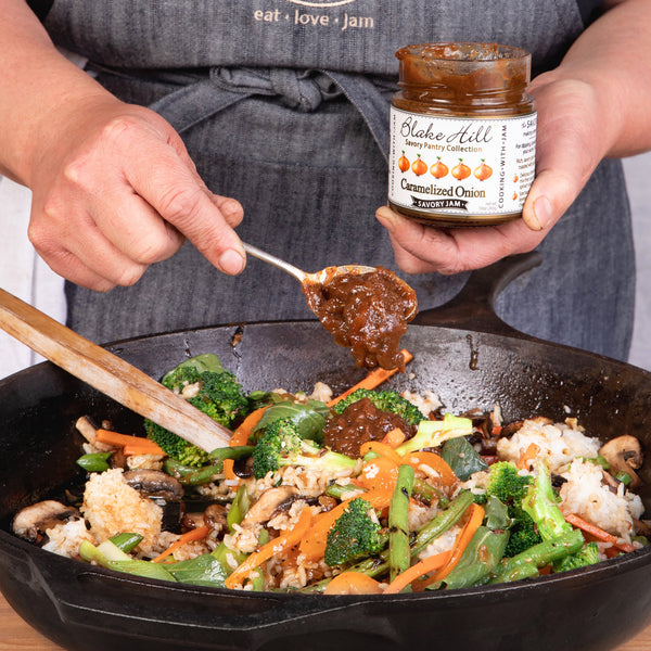 Veggie Stir Fry in a cast iron pan with Blake Hill Preserves Caramelized Onion Savory Jam.