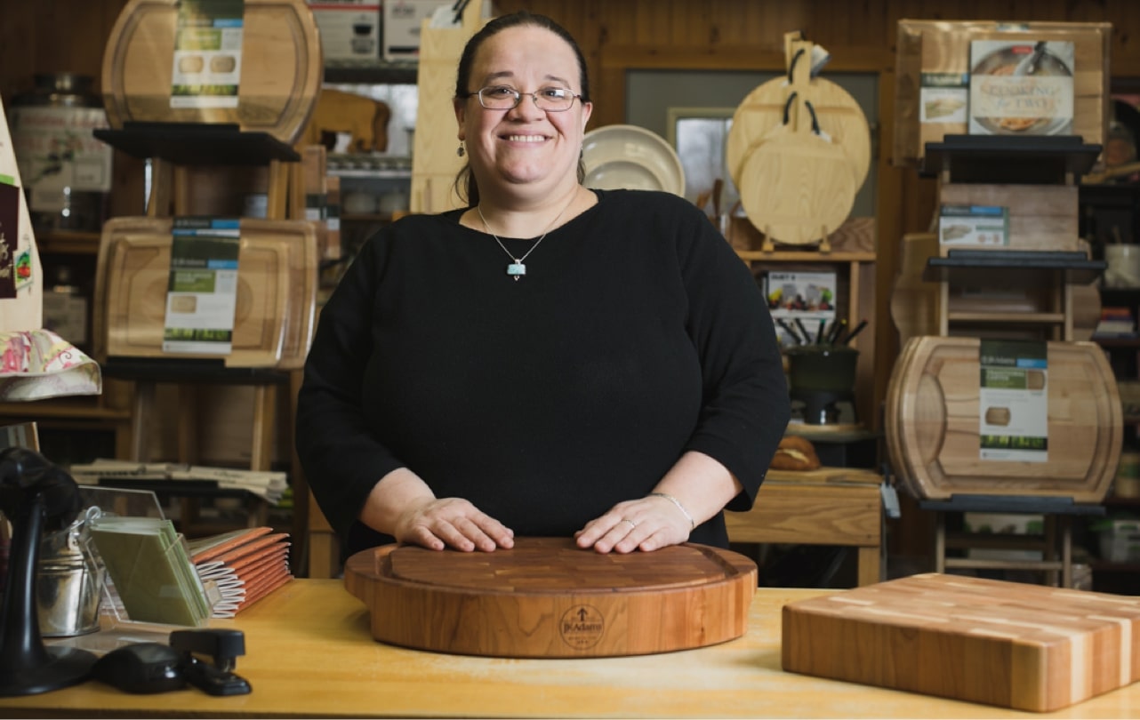 person in front of a cutting board