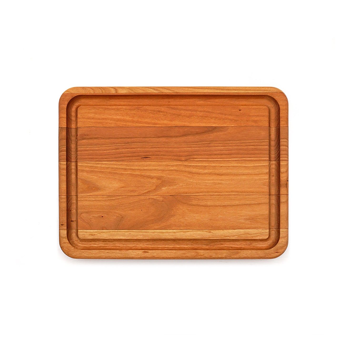 A rectangular wooden cutting board with rounded corners and a raised rim, shown from a top-down view on a solid white background.