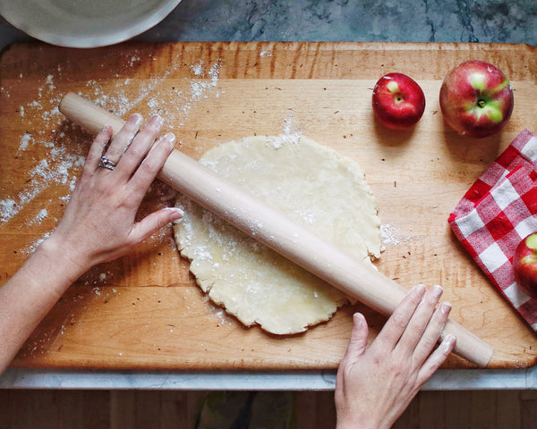 Rolling out the dough.
