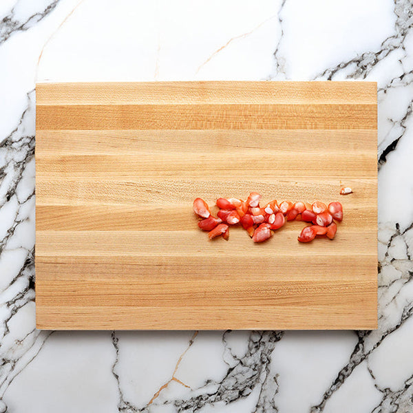 JK Adams Professional Edge Grain Cutting Board with chopped tomatoes