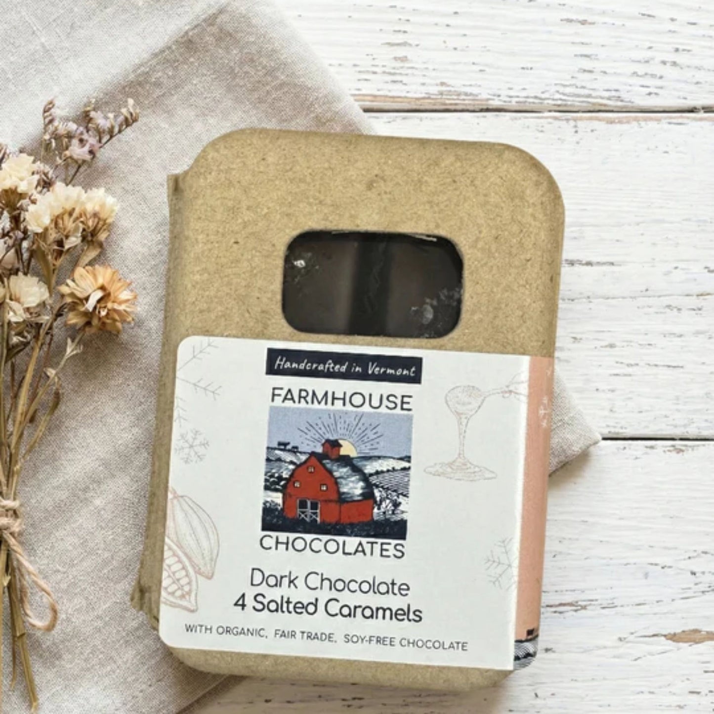 Farmhouse Chocolates packaging with a label on a wooden surface