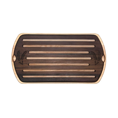 Wooden cutting board with slotted design on a white background