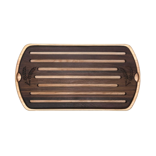 Wooden cutting board with slotted design on a white background
