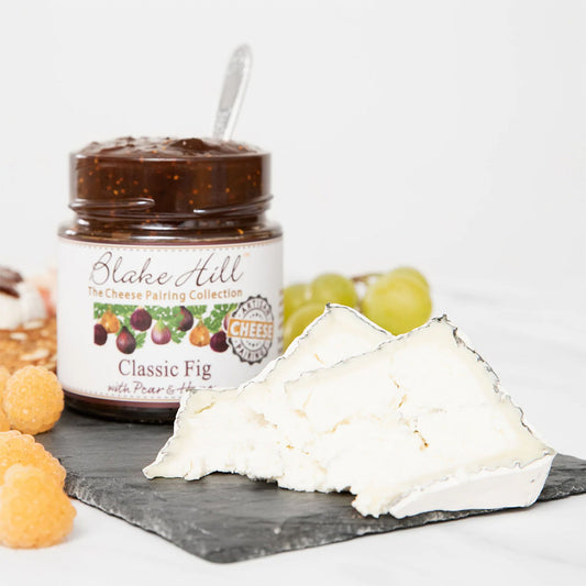 Blake Hill Classic Fig with Pear & Honey Preserves on  slate cheese board with a soft cheese. 