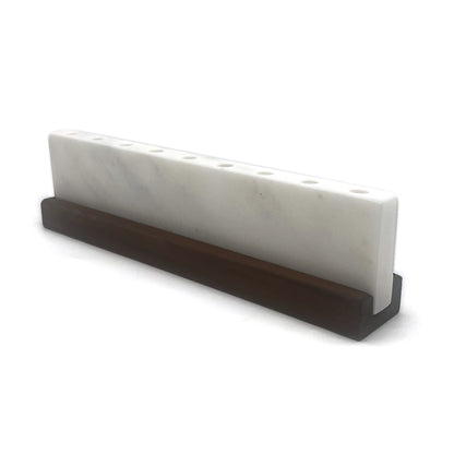 White marble slab on a dark brown stand against a white background